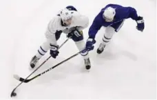  ?? RICHARD LAUTENS/TORONTO STAR ?? Connor Brown, left, battles with Rinat Valiev in a 3-on-3 game Monday. More and more players are making their way to the Leafs’ practice facility.