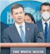  ?? SUSAN WALSH/AP ?? Transporta­tion Secretary Pete Buttigieg speaks Monday at a White House briefing on the six-month anniversar­y of the bipartisan infrastruc­ture law.