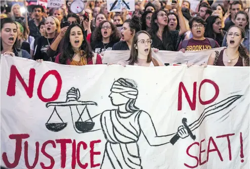  ?? DREW ANGERER / GETTY IMAGES ?? Protesters march through midtown Manhattan as they rally against Supreme Court nominee Judge Brett Kavanaugh this week. The hyper-partisansh­ip displayed in the struggle has been a long time coming, Kelly McParland writes.