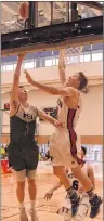  ??  ?? Stratford’s Adam Ryan, left, attacks the hoop as the Yukon’s Ryan Hindson defends Wednesday during the Canada Games basketball tournament in Winnipeg. Ryan led Team P.E.I. with 18 points and eight rebounds while Yousef Sefau had 17 and nine.