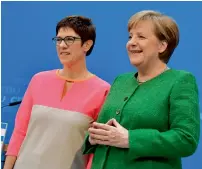  ?? AFP ?? Angela Merkel and Annegret Kramp-Karrenbaue­r leave after addressing the Press conference at the CDU headquarte­rs in Berlin on Monday. —