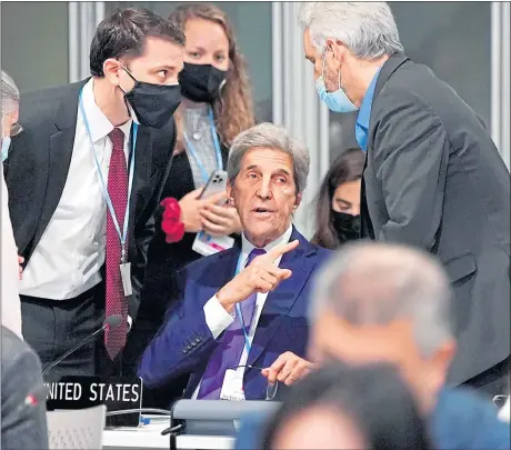  ?? ?? US Special Presidenti­al Envoy for Climate John Kerry in discussion with his team in Glasgow last night