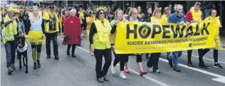  ?? PHOTOS: MIKE HOULAHAN/LINDA ROBERTSON ?? Hope springs eternal . . . Participan­ts in Saturday’s Hopewalk enter the Octagon to have their say in support of suicide prevention. Right: Life Matters founder Corinda Taylor.