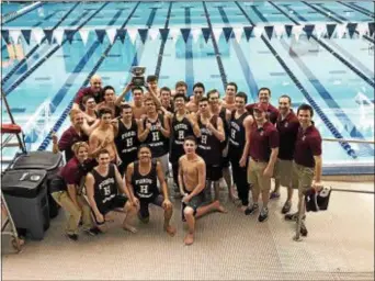  ?? SUBMITTED PHOTO ?? Members of the Haverford School swimming and diving team pose with their trophy after winning the program’s first Eastern Interschol­astic Championsh­ips championsh­ip Saturday at Franklin & Marshall College.