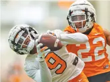  ?? TENNESSEE ATHLETICS PHOTO BY ANDREW FERGUSON ?? Tennessee receiver Jimmy Calloway makes a catch in front of Volunteers defensive back Jaylen McCollough during a practice earlier this spring. The Vols will wrap up Josh Heupel’s first spring with Saturday’s Orange & White contest inside Neyland Stadium.