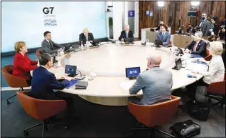  ??  ?? Clockwise from left, German Chancellor Angela Merkel and French President Emmanuel Macron, British Prime Minister Boris Johnson, U.S. President Joe Biden, Canadian Prime Minister Justin Trudeau, Italy’s Prime Minister Mario Draghi, European Commission President Ursula von der Leyen, European Council President Charles
Michel, and Japan’s Prime Minister Yoshihide Suga sit around a table during the G-7 summit at the Carbis Bay Hotel in Carbis Bay, St. Ives, Cornwall, England, Friday, June 11, 2021. Leaders of the G-7 begin their first of three days of meetings on Friday, in which they will discuss COVID-19, climate, foreign policy and the economy. (AP)