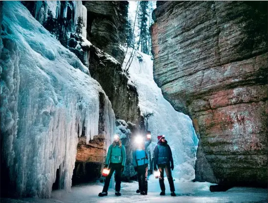  ?? Mike Seehagel Tourism Jasper ?? THE ALBERTA TOWN of Jasper in the Canadian Rockies has managed to retain its Old World and natural charms, as seen here along the Maligne Canyon Ice Walk.