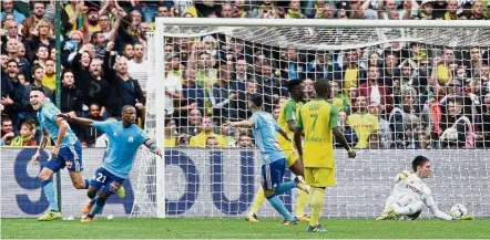  ?? — AFP ?? Back of the net: Marseille’s Lucas Ocampos (left) reeling away after scoring against Nantes on Saturday.