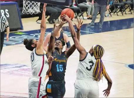  ?? DAVID BUTLER II/POOL PHOTO VIA AP ?? UConn post players Olivia Nelson-Ododa, left, and Aaliyah Edwards, right, deny Marquette’s Camryn Taylor a shot at the basket during Monday’s game in Storrs. The No. 1 Huskies play No. 8 St. John’s at noon today in the Big East Tournament quarters at Mohegan Sun Arena.
UCONN VS. ST. JOHN’S Noon, Mohegan Sun Arena, FS1