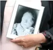  ??  ?? Maria Leslie, also left, holds a photo of her son Thomas