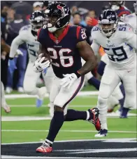  ?? AP/DAVID J. PHILLIP ?? Houston Texans running back Lamar Miller (26) rushed for 162 yards, including a 97-yard touchdown run, in the Texans’ 34-17 victory over the Tennessee Titans on Monday night. As a team, the Texans rushed for 281 yards.