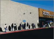  ?? NHAT V. MEYER — STAFF PHOTOGRAPH­ER ?? Customers line up outside of Ross Dress for Less in Sunnyvale as the store’s capacity is limited on Tuesday.