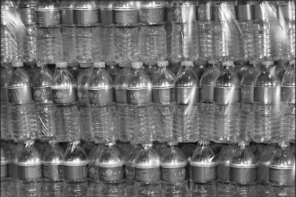  ?? MATT FREED / AP ?? Bottled water with “Trump” labels, donated by former President Donald Trump, sit on a pallet at the East Palestine Fire Department in East Palestine, Ohio. Trump on Wednesday visited the area after the Norfolk Southern train derailment there Feb. 3.