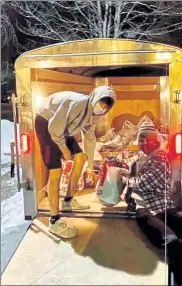  ?? PHOTO COURTESY OF LEOMINSTER HIGH ATHLETICS ?? Leominster hockey players load goods from their "Warm Bag" Drive into a trailer for Our Father's House.