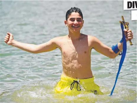  ?? Picture: SCOTT RADFORD- CHISHOLM ?? SACRED PRIZE: Jonathan Gatis, 13, of Mount Louisa, won the Throwing of the Cross at the Rockpool.