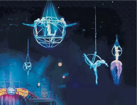  ?? PHOTOS COURTESY OF FELD ENTERTAINM­ENT ?? An aerial ballet is executed on a specially designed spinning apparatus and smaller orbs suspended above the arena floor.