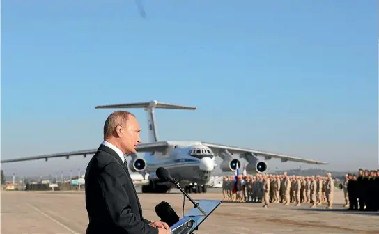  ?? PHOTO: GETTY IMAGES ?? Russian President Vladimir Putin talks to his troops at Khmeimim airbase in Latakia during his first visit to Syria.