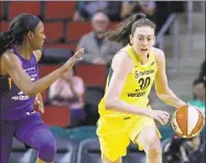  ?? Elaine Thompson / Associated Press ?? In this May 8 file photo, the Storm’s Breanna Stewart races up the court with Phoenix Mercury’s Chelsea Nelson in the second half of a WNBA exhibition game in Seattle. Several months earlier, Stewart revealed that she was sexually abused as a child.