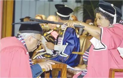  ?? Picture: AFP ?? HONOURED. Ahmed Kathrada receives an Honorary Doctorate from Vice-Chancellor of the University of Durban Westville Mapula Ramashala in 2002 in recognitio­n of his life-long contributi­on to the liberation struggle. Kathrada was one of the Rivonia treason...