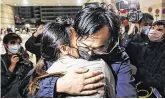  ?? PHOTO: GETTY ?? Embrace: Hong Kong democracy activist Mike Lam King-Nam hugs his wife following his release on bail.