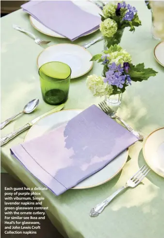  ??  ?? Each guest has a delicate posy of purple phlox with viburnum. Simple lavender napkins and green glassware contrast with the ornate cutlery. For similar see Ikea and Heal’s for glassware, and John Lewis Croft Collection napkins