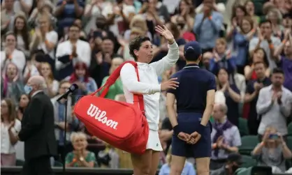  ??  ?? Carla Suárez Navarro waves to the crowd as they applaud following her defeat to Ashleigh Barty.Photograph: Kirsty Wiggleswor­th/AP