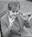  ?? Jeff Mitchell, AFP/Getty Images ?? Scotland’s first minister, Nicola Sturgeon, answers questions in the debating chamber of the Scottish Parliament this month in Edinburgh.