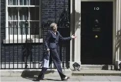  ??  ?? LONDON: British Prime Minister Theresa May leaves 10 Downing Street in London after attending a cabinet meeting there. — AP