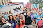  ?? AP ?? A celebratio­n outside the Supreme Court, on Friday, in Washington. —