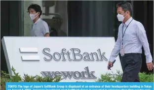  ?? ?? TOKYO: The logo of Japan’s SoftBank Group is displayed at an entrance of their headquarte­rs building in Tokyo on August 8, 2022. Japanese investment giant SoftBank Group is expected to announce their first quarter earnings later in the day. —AFP