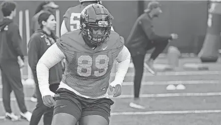  ?? JOSHUA MCCOY/OLE MISS ATHLETICS ?? Defensive end JJ Pegues runs through a drill at Ole Miss spring practice.