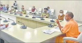  ?? HT PHOTO ?? Chief minister Yogi Adityanath chairing a meeting on Covid-19 in Lucknow on Sunday night.