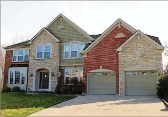  ?? CONTRIBUTE­D PHOTO BY KATHY TYLER ?? The 2-story has about 4,400 square feet of living space, including the lower level. The brick-and-stone house is located within Woodburn Farms of Washington Twp. and includes 5 bedrooms and 2-car garage.