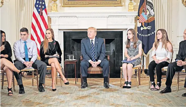  ??  ?? President Trump last night held a ‘listening session’ at the White House for the survivors of mass shootings, including six teenagers from the Marjory Stoneman Douglas High School in Parkland, Florida, where 17 people died