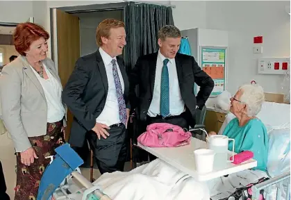  ?? DENISE PIPER/FAIRFAX NZ ?? MPs Maggie Barry and Jonathan Coleman visit a patient with then Prime Minister Bill English.