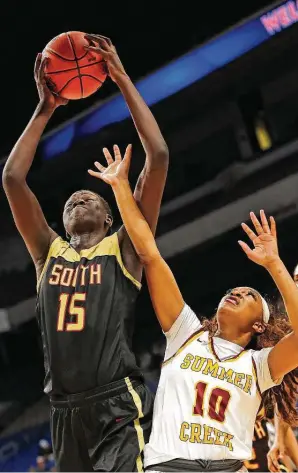  ?? Ronald Cortes / Contributo­r ?? South Grand Prairie 6-5 center Adhel Tac (15) was a force on both ends of the court, posting a double-double as the Warriors took down Summer Creek in the semifinals.