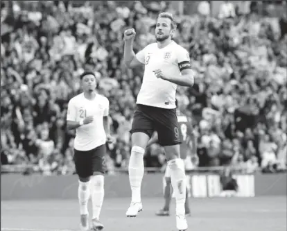  ??  ?? England’s Harry Kane celebrates scoring their fourth goal to complete his hat-trick REUTERS/David Klein