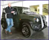  ??  ?? Dealer Principal Gerrie van der Kaay standing with a Suzuki Jimny just before its delivery to another happy customer.