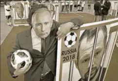  ?? REUTERS ?? ▪ A Reporter Without Borders activist wears a Vladimir Putin mask at a protest against curbing the freedom of the Press in Paris, June 13