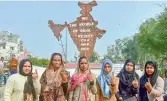  ??  ?? Protestor show their ink-marked fingers near Shaheen Bagh in New Delhi on Saturday