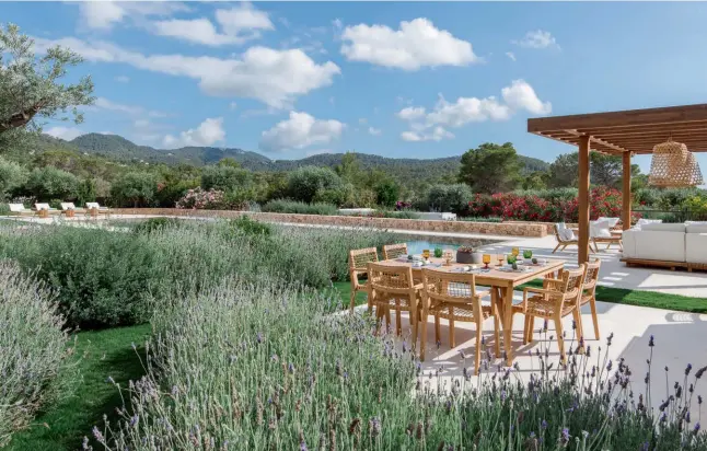  ??  ?? This page: The landscaped garden sits pretty next to the pool and a pergola, which are complement­ed with natural teak outdoor furnishing­s; this bathroom features herringbon­e-patterned encaustic floor tiles and polished plaster walls