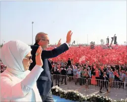  ?? PICTURE: REUTERS ?? Turkey’s President Tayyip Erdogan and his wife, Emine Gulbaran, greet people during the Democracy and Martyrs Rally in Istanbul, Turkey, yesterday