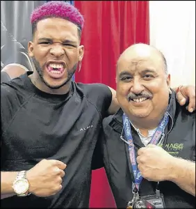  ?? SUBMITTED PHOTO ?? Truro dentist Dr. Anil Makkar, right, is seen with American fitness model Terron Beckham, cousin of New York Giants receiver Odell Beckham, during the 2018 Arnold Sports Festival in Columbus, Ohio. Beckham is sporting a New Age Performanc­e mouthpiece.