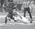  ??  ?? Arizona running back J.J. Taylor (21) carried 40 times on Friday night vs. Colorado in Tucson.