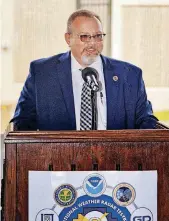  ??  ?? Kurt Hondl, program manager for NOAA National Severe Storms Laboratory, speaks during the unveiling of the new Advanced Technology Demonstrat­or weather radar system in Norman on Thursday.