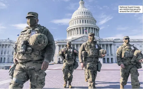  ??  ?? National Guard troops are reinforcin­g security around the US Capitol