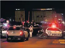  ?? Picture: AFP ?? SEALED OFF: Police form a perimeter around the road leading to the Mandalay Hotel from which a gunman opened fire