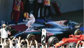  ??  ?? Race winner Lewis Hamilton on his Mercedes-Benz F1 W08 Hybrid celebrates in parc ferme at the Spanish Grand Prix.