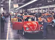  ??  ?? The VW Beetle became a symbol of West Germany’s post-war revovery