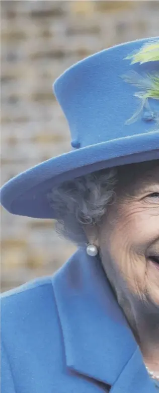  ??  ?? 0 Queen Elizabeth smiles during a vist to the Haig Housing Trust in Morden, southwest London to open new housing for veterans